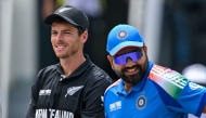 India's captain Rohit Sharma (R) and his New Zealand's counterpart Mitchell Santner arrive at the field for the toss at the Dubai International Stadium in Dubai on March 9, 2025. (Photo by Ryan Lim / AFP)