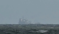 The Stena Immaculate tanker that collided with Solong container vessel appear at a distance off the coast of Withernsea, east of England, on March 11, 2025. (Photo by Paul Ellis / AFP)