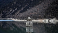 This photograph taken on January 21, 2025 shows a view of the Mediano reservoir, with the Church of Asuncion of Mediano visible due to the low water-level, in Mediano, Huesca province. Photo by ANDER GILLENEA / AFP