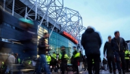 Football fans arrive ahead of the UEFA Europa league stage football match between Manchester United and FC Twente at Old Trafford stadium in Manchester, northwest England, on September 25, 2024. Photo by Darren Staples / AFP