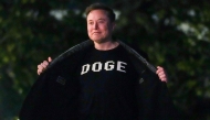 Elon Musk shows off a shirt that says 