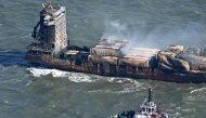 Smoke rises from damaged containers on the deck of the MV Solong cargo ship in the North Sea, off the coast of Withernsea, east of England, on March 11, 2025, after it collided with the MV Stena Immaculate tanker on March 10. Photo by Paul ELLIS / AFP