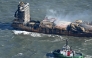 Smoke rises from damaged containers on the deck of the MV Solong cargo ship in the North Sea, off the coast of Withernsea, east of England, on March 11, 2025, after it collided with the MV Stena Immaculate tanker on March 10. Photo by Paul ELLIS / AFP