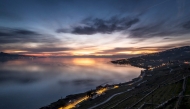 This photograph shows the Lake Geneva after sunset above the vineyard terraces of Lavaux, near Chexbres, western Swizterland, on March 6, 2025. (Photo by Fabrice Coffrini / AFP)