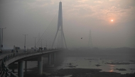 (Files) A general view shows the Signature Bridge over the Yamuna River on a smoggy winter morning in New Delhi on December 20, 2024. (Photo by Arun Sankar / AFP)