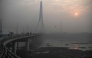 (Files) A general view shows the Signature Bridge over the Yamuna River on a smoggy winter morning in New Delhi on December 20, 2024. (Photo by Arun Sankar / AFP)