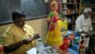 A hand-painted Channapatna doll displayed for sale at artisan Venkatesh's toy store in Channapatna in the Ramanagara district of India's Karnataka state. (Photo by Idrees Mohammed / AFP) 