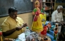 A hand-painted Channapatna doll displayed for sale at artisan Venkatesh's toy store in Channapatna in the Ramanagara district of India's Karnataka state. (Photo by Idrees Mohammed / AFP) 