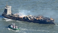 Smoke rises from the MV Solong cargo ship in the North Sea, off the coast of Withernsea, east of England, on March 11, 2025. (Photo by Paul Ellis / AFP)