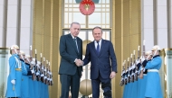 This handout photograph taken and released by Turkish Presidency Press Office on March 12, 2025, shows Turkey's President Recep Tayyip Erdogan (left) welcoming Poland's Prime Minister Donald Tusk prior to their meeting at the Presidential Complex in Ankara. (Photo by HANDOUT / Turkish Presidency Press Office / AFP)
