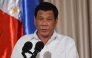 (FILES) Philippine President Rodrigo Duterte delivers his speech during the presentation ceremony of the signed document on the Organic Law for Bangsamoro Autonomous Region of Muslim Mindanao to officials of the Moro Islamic Liberation Front (MILF) at Malacanang palace in Manila on August 6, 2018. (Photo by TED ALJIBE / AFP)
