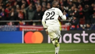 Real Madrid's German defender #22 Antonio Ruediger celebrates scoring during the penalty shoot out after the UEFA Champions League Round of 16 second leg football match between Club Atletico de Madrid and Real Madrid CF at the Metropolitano stadium in Madrid on March 12, 2025. (Photo by JAVIER SORIANO / AFP)
