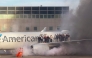 This image courtesy of Branden Williams shows passengers standing on the wing of an American Airlines plane as they are evacuated after it caught fire while at a gate at Denver International Airport in Denver, Colorado, March 13, 2025. (Photo by Branden Williams / Courtesy of Branden Williams / AFP) 