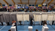 Photo used for representational purposes. Greenlanders queue to vote at the sports hall in Nuuk, Greenland, on March 11, 2025, on the day of Greenland, the autonomous Danish territory legislative elections. Photo by Odd ANDERSEN / AFP.