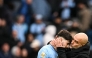 Manchester City's Spanish manager Pep Guardiola (R) kisses Manchester City's Croatian defender #24 Josko Gvardiol (L) at the end of the English Premier League football match between Manchester City and Brighton and Hove Albion at the Etihad Stadium in Manchester, north west England, on March 15, 2025.(Photo by Oli SCARFF / AFP)