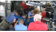 This screengrab made from a NASA livestream shows the SpaceX Dragon Crew-10 members, including NASA astronauts Anne McClain and Nichole Ayers, JAXA (Japan Aerospace Exploration Agency) astronaut Takuya Onishi, and Roscosmos cosmonaut Kirill Peskov, greeting International Space Station crew members including NASA astronauts Butch Wilmore (L) and Suni Williams (3R) on March 16, 2025. (Photo by NASA / AFP) 