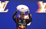 Second-placed Red Bull Racing's Dutch driver Max Verstappen celebrates on the podium with his trophy at the end of the Australian Formula One Grand Prix at Albert Park Circuit in Melbourne on March 16, 2025. (Photo by William West / AFP) 