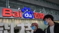 People walk past a Baidu logo outside the company headquarters in Beijing on February 2, 2024. Photo by Jade GAO / AFP