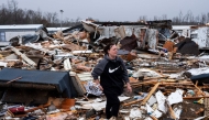 Stevie Kara searches for personal items after her home was destroyed on March 15, 2025 in Poplar Bluff, Missouri. Photo by Brad Vest / GETTY IMAGES NORTH AMERICA / Getty Images via AFP