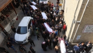 The bodies of victims killed in overnight Israeli airstrikes on the Gaza Strip are carried on stretchers at Al-Ahli Arab hospital in Gaza City ahead of their burial on March 18, 2025. (Photo by Omar AL-QATTAA / AFP)