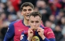 Barcelona's Spanish midfielder #17 Marc Casado (R) celebrates scoring his team's second goal next to Barcelona's Spanish defender #35 Gerard Martin during the Spanish league football match between FC Barcelona and Real Sociedad at Estadi Olimpic Lluis Companys in Barcelona on March 2, 2025. (Photo by LLUIS GENE / AFP)
