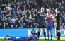 Crystal Palace's French striker #14 Jean-Philippe Mateta (L) lies injured after a dangerous challenge from Millwall's English goalkeeper #13 Liam Roberts (3R) in south London on March 1, 2025. (Photo by Glyn Kirk / AFP)

