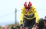 Team Visma-Lease a Bike's Danish rider Jonas Vingegaard wearing the overall leader's yellow jersey reacts as he crosses the finish line of the 5th stage of the Paris-Nice cycling race, 203,3 km between Saint-Just-en-Chevalet and La Côte-Saint-André, on March 13, 2025. Photo by Anne-Christine POUJOULAT / AFP