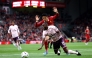 Liverpool's Japanese midfielder #03 Wataru Endo vies for the ball with Brentford's Nigerian midfielder #15 Frank Onyeka during the English Premier League football match between Liverpool and Brentford at Anfield in Liverpool, north west England on August 25, 2024. (Photo by Darren Staples / AFP)

