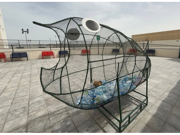 A large fish-shaped cage has been set up for students to fill with plastic bottles, which will later be recycled.