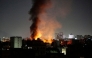 Smoke plumes rise above buildings following bombardment on Yemen's capital Sanaa on March 19, 2025. (Photo by AFP)