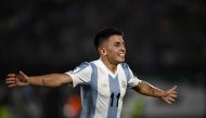 TOPSHOT - Argentina's midfielder #11 Thiago Almada celebrates after scoring during the 2026 FIFA World Cup South American qualifiers football match between Uruguay and Argentina at the Centenario stadium in Montevideo, on March 21, 2025. (Photo by Eitan ABRAMOVICH / AFP)
