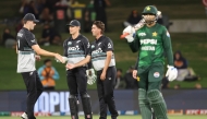 New Zealand's Zakary Foulkes (C) celebrates with Will O'Rourke (L) and Mitchell Hay after taking the wicket of Pakistan's Shaheen Shah Afridi during the fourth Twenty20 international cricket match between New Zealand and Pakistan at Bay Oval in Mount Maunganui on March 23, 2025. (Photo by Michael Bradley / AFP)