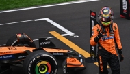 McLaren's Australian driver Oscar Piastri celebrates winning the Formula One Chinese Grand Prix at the Shanghai International Circuit in Shanghai on March 23, 2025. (Photo by Jade GAO / AFP)