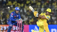 Chennai Super Kings' Rachin Ravindra (R) plays a shot during the Indian Premier League (IPL) Twenty20 cricket match between Chennai Super Kings and Mumbai Indians at the MA Chidambaram Stadium in Chennai on March 23, 2025. (Photo by R.Satish BABU / AFP)