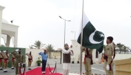 Ambassador of Pakistan to Qatar H E Muhammad Aamer hoisting the national flag at the Embassy of Pakistan premises to mark the National Day yesterday.