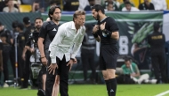 Saudi Arabia's French coach Herve Renard speaks with the referee during the FIFA World Cup 2026 Asia zone qualifiers group C football match between Saudi Arabia and China at the Al-Awwal Park in Riyadh on March 20, 2025. (Photo by AFP)
