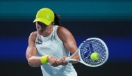 Iga Swiatek of Poland returns a shot against Elina Svitolina of Ukraine during their match on day 7 of the Miami Open at Hard Rock Stadium on March 24, 2025 in Miami Gardens, Florida. (Photo by Rich Storry/Getty Images via AFP)