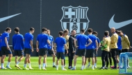 Barcelona's German coach Hans-Dieter Flick (C) and players attend a training session on the eve of the UEFA Champions League quarter final first leg football match between Barcelona and Borussia Dortmund at the Joan Gamper training ground in Sant Joan Despi, near Barcelona, on April 8, 2025. (Photo by Josep LAGO / AFP)