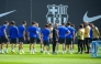 Barcelona's German coach Hans-Dieter Flick (C) and players attend a training session on the eve of the UEFA Champions League quarter final first leg football match between Barcelona and Borussia Dortmund at the Joan Gamper training ground in Sant Joan Despi, near Barcelona, on April 8, 2025. (Photo by Josep LAGO / AFP)