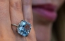A Sotheby's employee displays the 10.03-carat 'Mediterranean Blue' diamond ring during a preview ahead of a public exhibition in Abu Dhabi on April 8, 2025. (Photo by Giuseppe Cacace / AFP)