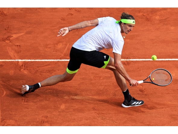 Germany's Alexander Zverev returns the ball to Italy's Matteo Berrettini during the Monte Carlo ATP Masters Series Tournament round of 32 tennis match on the Rainier III court at the Monte Carlo Country Club in Roquebrune-Cap-Martin on April 8, 2025. (Photo by Valery HACHE / AFP)