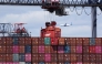 A shipping container is moved at the Port Jersey Container Terminal in Jersey City, New Jersey on April 8, 2025. (Photo by Charly Triballeau / AFP)
