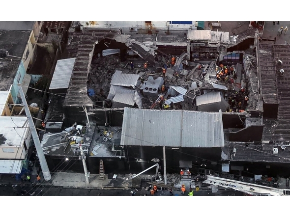 Photo shows an aerial view of the Jet Set nightclub after the collapse of its roof, in Santo Domingo, on April 8, 2025. (Photo by Handout / Prensa Servicio 911 / AFP)