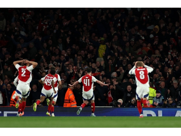 Arsenal's English midfielder #41 Declan Rice celebrates scoring the team's second goal during the UEFA Champions League Quarter final first leg football match between Arsenal and Real Madrid, at the Emirates Stadium, in London, on April 8, 2025. (Photo by Adrian Dennis / AFP)
 