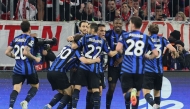 Inter Milan celebrate scoring the opening goal during the UEFA Champions League first leg quarter-final football match between FC Bayern Munich and Inter Milan in Munich, southern Germany, on April 8, 2025. (Photo by Alexandra Beier / AFP)