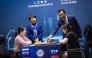 QCA President Mohammed Al Mudahka makes the opening move for match between China's Ju Wenjun and Tan Zhongyi.  