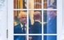 (Files) (L-R) Senior Counselor to the President for Trade and Manufacturing, Peter Navarro, White House deputy chief of staff for policy and US homeland security advisor Stephen Miller, and Elon Musk speak inside the Oval Office of the White House on March 14, 2025. (Photo by Roberto Schmidt / AFP)
