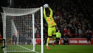 Manchester United's Cameroonian goalkeeper #24 Andre Onana saves a shot during the English Premier League football match between Nottingham Forest and Manchester United at The City Ground in Nottingham, central England, on April 1, 2025. (Photo by Paul ELLIS / AFP) 