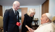 This photo taken on April 9, 2025 and handout on April 10, 2025 by The Vatican Media shows Pope Francis during a private meeting with Britain's King Charles III and Queen Camilla in The Vatican. (Photo by Handout / Vatican Media / AFP) 