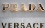 This combination of pictures created on April 10, 2025 shows a file picture of a logo outside the fashion house and luxury goods Versace shop on the Avenue Montaigne in Paris. Photo by STEPHANE DE SAKUTIN / AFP
